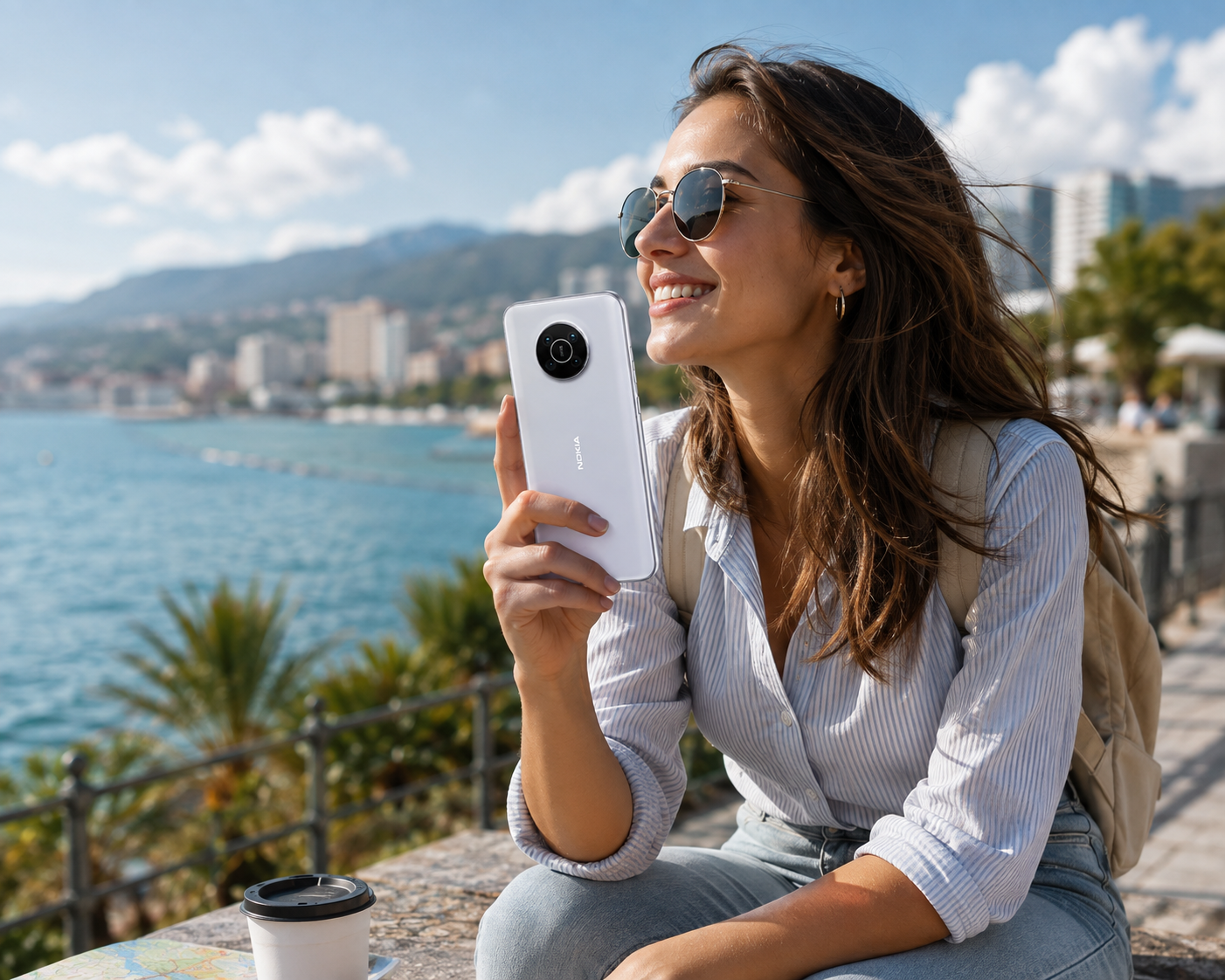 Woman holding a Snow Nokia X10 5G smartphone, rear camera visible