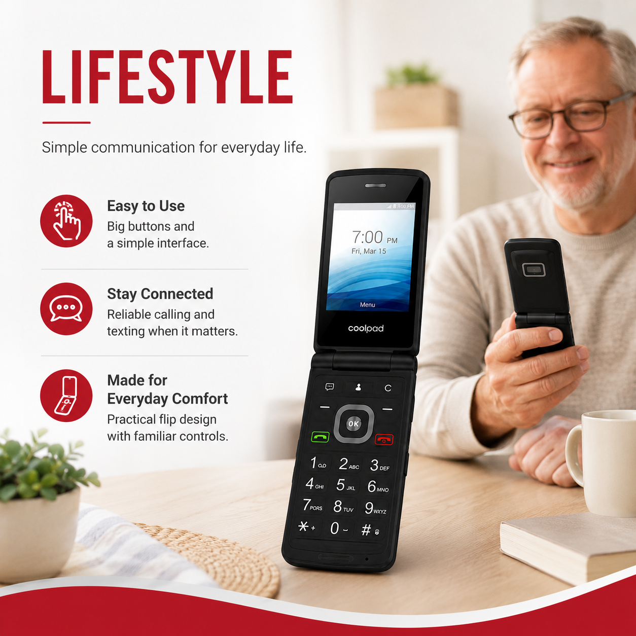 Black flip phone held in hand with open screen and keypad visible