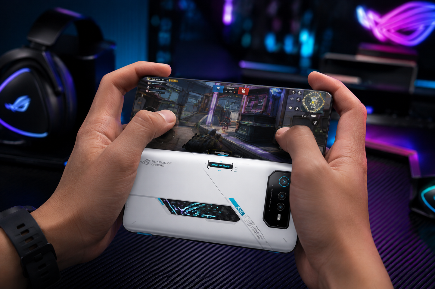 Asus ROG Phone 6 Hands holding a white gaming smartphone showing a blue game screen